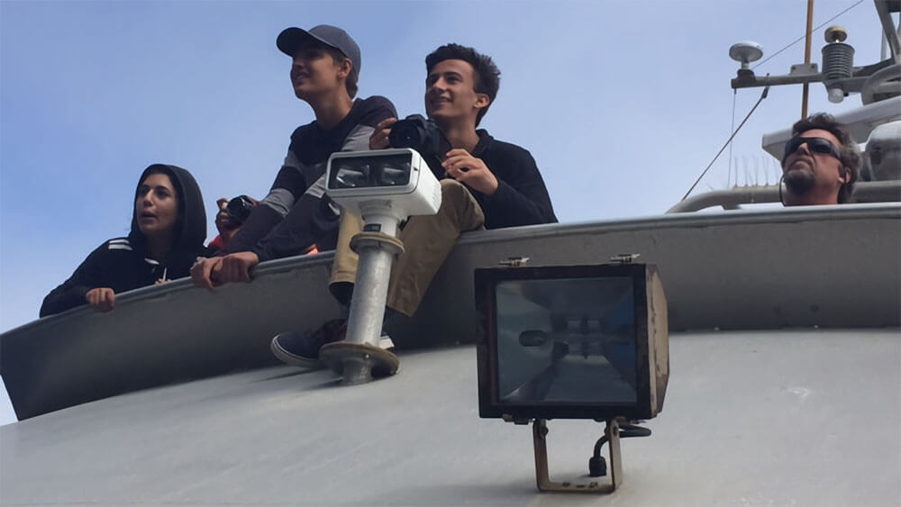 students aboard a research vessel